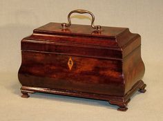 an old wooden box sitting on top of a table