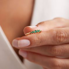 Your Minimalist Emerald Ring is stylish, dainty and pretty ideal for everyday use. Details of solid gold handmade Dainty Green Gemstone Jewelry are very eye-catching. It is a great gift for your loved ones. This jewelry will be an indispensable piece of yours. This meaningful May Birthstone Ring with high quality handwork will be a legacy you can leave to your family its.  * 5 Stone Emerald Ring Details * Material / Gold Kt:  14K (585), 18K (750), 8K (333) * Available Gold Colors: Yellow Gold, W Emerald Engagement Ring Simple, Gemstone Ring, Emerald Ring Design, Emerald Band Ring, Emerald Band, May Birthstone Rings, Green Emerald Ring, Simple Engagement Rings, Birthstone