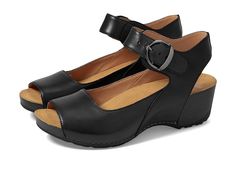 Dansko Tiana - Women's Shoes : Black : Tiana is the perfect heeled sandal to add to any spring wardrobe. Classic styling and premium comfort are created with a sleek ankle and forefoot strap for style that fits. Easy to dress up and comfortable enough to last all day, Tiana is a warm-weather essential. Leather wedge sandals feature full grain leather upper in a stylish, comfortable silhouette. Chrome-free leather linings and Dri-lex Energy Power Mesh lining with energy return with Aegis Shield o Comfortable Open Toe Heels With Heel Strap, Comfortable Open Toe Heels With Arch Support, Black Leather Wedge Sandals With Arch Support, Comfortable Black Wedge Sandals With Leather Footbed, Black Leather Slingback Sandals With Ortholite Insole, Medium Width Open Toe Sandals With Arch Support, Black Open Toe Sandals With Ortholite Insole, Comfortable Open Toe Heels With Removable Insole, Open Toe Heels With Arch Support