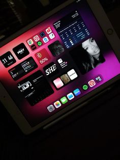 an ipad with the home screen lit up and icons displayed on it's side