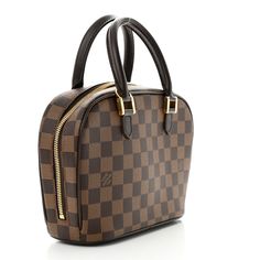 This is an authentic LOUIS VUITTON Damier Ebene Sarria Mini. This stylish tote is beautifully crafted of Louis Vuitton Damier check canvas. The bag features dark brown leather rolled top handles and trim with brass hardware. The zipper opens to an orange microfiber interior with a patch pocket. Monogrammed Duffle Bag, Louis Vuitton Empreinte, Louis Vuitton Vernis, Mini Moon, Leather Roll, Louis Vuitton Damier Azur, Louis Vuitton Damier Ebene, Damier Ebene, Wallet Chain