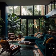 a living room filled with furniture and lots of plants on the windows sills