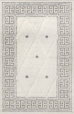 a white rug with an intricate design on the bottom and sides, in grey tones