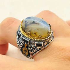 Handmade 925k silver men ring. Make your father, boyfriend, brother and grandfather happy with silver ring designs that reflect medieval and Ottoman era style. Make them feel valuable with such silver rings made of pure silver for birth days and special occasions. Attract attention of people around you with precious stones on silver. Important Note: Since the stones of the Yemeni agate rings are patterned, there may be minor pattern changes. Item weight: 14 gr Silver * Thank you for looking at my shop. * Also, you may prefer to make yourself feel special. * If you have any questions please send me an e-mail. * Our production time is 3 business day * After purchasing product, it will be sent to you inside gift box. * If you have a sensitive skin, you must definitely wear silver accessories. Silver Agate Signet Ring As Gift, Silver Agate Signet Ring For Gift, Agate Rings, Brown Agate, Silver Ring Designs, Tarnished Silver, Men Ring, Agate Ring, Silver Accessories