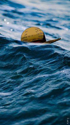 a yellow buoy floating on top of the ocean