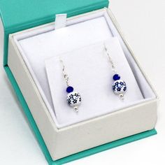 Delft Blue Ceramic Earrings 925 Sterling Silver & Blue Floral Victorian Earrings, Gift for Her 100% of net profits donated to the Hawaii Wildlife Fund to help and protect the critically endangered Honu'ea Sea Turtles. *Minimalist Elegance. Cute and Dainty Dangle Drop. For all ages *Painted Ceramic Delft Style Floral Bead, 8mm. *Sapphire Blue Glass Bead *925 Sterling Silver French Hook Earring and beads (CAN BE MADE WITH STERLING SILVER POST. JUST LET ME KNOW). *The Earrings are presented in Hypoallergenic Sapphire Earrings For Gift, Blue Drop Earrings As Gift For Her, Nickel-free Blue Earrings As Gift For Her, Nickel Free Blue Earrings As Gift For Her, Handmade Sapphire Earrings For Gift, Sapphire Drop Earrings Gift, Nickel Free Sapphire Earrings, Blue Earrings With Ear Wire For Anniversary, Blue Earrings For Anniversary