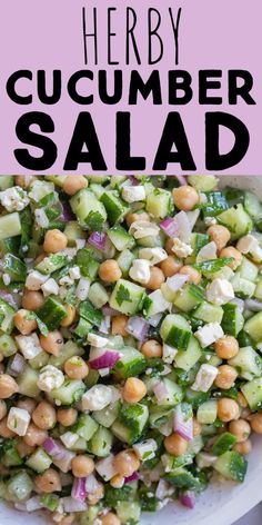 a white bowl filled with cucumber salad on top of a table