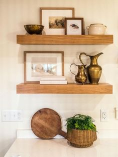 two wooden shelves above a white counter top