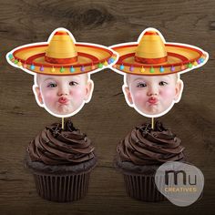 two cupcakes with chocolate frosting and sombreros on top