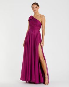 a woman in a long purple dress with one leg slited up and the other side split