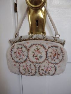 Vintage Evening Bag With Handwork For Formal Occasions, Formal Cream Embroidered Evening Bag, Vintage Handwork Evening Bag For Wedding, Elegant Cream Bag For Luncheon, Elegant Cream Bags For Luncheon, Elegant Cream Bags With Floral Embroidery, Vintage Wedding Evening Bag With Handwork, Vintage Floral Embroidery Bags For Formal Occasions, Elegant Cream Bag With Floral Embroidery