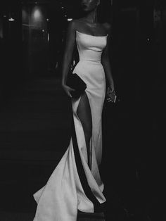 black and white photo of woman in evening gown