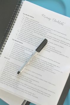 a notepad and pen sitting on top of a paper with the words morning checklist written in it