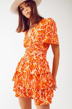 Introducing our Mini V Neck Dress in Floral Orange Print, a delightful and feminine piece that will instantly elevate your style. This dress is perfect for those sunny days when you want to embrace the beauty of nature with a touch of romance. The mini length of this dress adds a flirty and playful vibe, making it ideal for both casual outings and special occasions. The vibrant floral print in shades of orange adds a pop of color and brings a sense of freshness to your look, perfect for embracin Orange Dress Casual, Perfect Fall Outfit, Dress Drape, Floral Print Design, Orange Print, Mini Dress Fashion, Tier Skirt, Shades Of Orange, Tiered Skirt