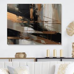 a living room with white couches and gold accents on the wall above it is a large abstract painting