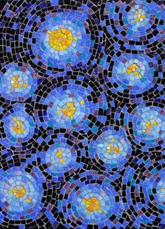 a blue and yellow mosaic tile with circles in the shape of flowers on black background