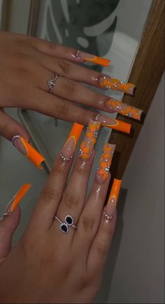 Orange Acrylic Nails Prom, Long Nails Coffin Summer, Orange Sets Nails, Orange Nail Styles, Long Square Acrylic Nails Orange, Neon Yellow Design Nails, Orange Nails With Initial, Extravagant Nail Designs, Nails Acrylic Designs Orange