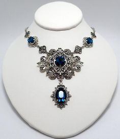 This is a new handmade necklace. It is made with antiqued silver plated filigrees, accented with high quality DARK TEAL glass rhinestones. Decorated portion is 7" wide and 3 1/4" tall in the center. Necklace is adjustable 15-18" with a lobster clasp and chain extender. If you would like a different length, please send us a message. Hummingbird Jewelry, Steampunk Goth, Antique Silver Necklace, Hummingbird Necklace, Teal Glass, Tiaras Jewellery, Chunky Chain Necklaces, Choker Pendant, Boho Pendant