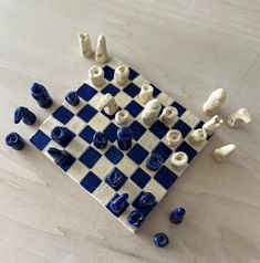 a chess board with blue and white pieces on it