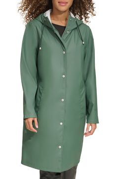 Durable and versatile, this hooded rain jacket features a drawstring hood, covered zipper placket and welt pockets to keep your hands warm and dry. 38 1/2" length Drawstring hood Water-resistant 100% polyurethane Machine wash, tumble dry Imported Hooded Raincoat With Drawstring Hood For Travel, Travel Raincoat With Drawstring Hood, Green Casual Raincoat For Rainy Weather, Casual Green Raincoat For Rainy Weather, Green Weatherproof Raincoat For Spring, Green Raincoat With Detachable Hood For Fall, Spring Raincoat With Storm Flap For Outdoor Use, Spring Outdoor Raincoat With Storm Flap, Casual Raincoat With Drawstring Hood