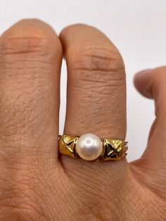 Vintage white cultured pearl  Sterling silver with gold setting   Re sizing has a $20 jeweler's fee. All rings are shipped in a nice gift box.   Check out our over a THOUSAND great reviews Engraving is $4 per letter and is not always perfect depending on the piece. It can take a few days if the jeweler is busy. This is payable to Paypal Judithsltd@gmail.com Gold Pearl Ring Stamped 14k For Gift, Classic Gold Pearl Ring For Anniversary, Classic Formal Jewelry With Hallmark, Luxury 14k Stamped Gold Pearl Ring, 14k Stamped Pearl Ring As Gift, Luxury Pearl Ring For Gift, Gold Pearl Drop Rings As A Gift, Gold Rings With Pearl Drop For Gift, Gold Rings With Pearl Drop For Formal Occasions