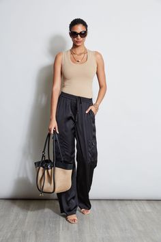 Luxe Washed Satin lends a chic patina and expression to the season's must have Cargo Pant. The elastic waist, cargo pocket details & fluid leg are the definition of sporty cool. Get ready for the compliments. Elie Tahari Exclusive Satin Cargo Pants 100% Polyester Relaxed Fit; Runs long Model is 5'9" and wearing size 4 Measurements: Front Rise 11.25"L; Inseam 33"L (approx. length for size S) Dry clean Imported Style #: E4027204 Black Satin Cargo Pants Outfit, Black Silk Pants Outfit, Satin Pants Outfit Casual, Black Satin Pants Outfit, Satin Cargo Pants Outfit, Silk Pants Outfit, Satin Pants Outfit, Satin Cargo Pants, Mom Fits