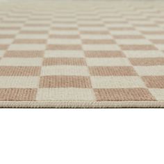 a beige and white checkered area rug