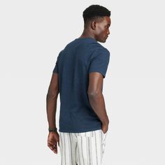 This Short-Sleeve Henley T-Shirt from Goodfellow & Co™ is a versatile and comfortable wardrobe pick. Made from 100% cotton, this short-sleeve henley tee feels soft and offers all-day cool comfort. Tailored in a regular fit with a henley neckline featuring a three-button placket, it features a solid hue that makes it easy to pair with the bottoms of your choice, and a below-waist length allowing it to worn tucked in or untucked. Goodfellow & Co™: Where style & fit are always in good company. Casual Jersey Shirt With Crew Neck, Casual Crew Neck Jersey Shirt, Navy Casual V-neck T-shirt, Fitted Navy Casual T-shirt, Navy Fitted Casual T-shirt, Casual Navy Jersey Top, Short Sleeve Henley, In Good Company, Henley T Shirt