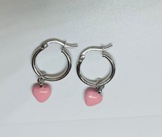 Pink enamel heart charms dangling from sterling silver hoops. These hoop earrings were designed to fit this petite heart charm and look beautiful! Cheap Pink Heart Charm Earrings, Pink Enamel, Sterling Silver Hoops, Jewelry Earrings Hoops, Silver Hoops, Charm Earrings, Pink Heart, Heart Charm, Silver Fashion