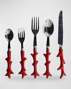 five forks, spoons and knives in the shape of fish