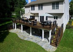 an aerial view of a house with deck and patio