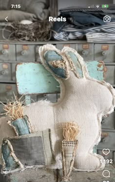 a stuffed animal sitting on top of a chair next to other furniture and decor items