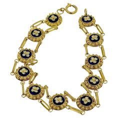 This Traditional Portuguese Bracelet is a magnificent example of classic Portuguese jewelry craftsmanship, combining rich materials and intricate design techniques. Made from 19kt yellow gold, the bracelet showcases the luxurious and warm tone of high-carat gold, offering a timeless and elegant appeal. The bracelet features exquisite blue and white enamel flower detailing, a hallmark of traditional Portuguese design. The vibrant blue and pristine white enamel are expertly applied to create a str Luxury Blue Gold Bracelet For Formal Occasions, Luxury Blue Gold Jubilee Bracelet, Yellow Gold Filigree Bracelets, Royal Gold Jewelry For Formal Occasions, Luxury Filigree Round Bracelets, Elegant Blue Bracelet With Intricate Design, Elegant Blue Bracelets With Intricate Design, Portuguese Jewelry, Italian Jewelry Designers