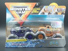 the monster jam truck is purple and orange in its package, it's on display