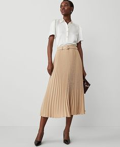 Elevate your wardrobe with the Ann Taylor Belted Pleated Midi Skirt, a perfect blend of sophistication and modern style. This skirt is designed to captivate with its elegant pleats and a chic self-tie buckle belt.

- Size: Regular - 8
- Color: Baguette
- Material: 100% Polyester
- Length: 34 1/4" long
- Features: Belt loops, hidden side zipper with hook-and-eye closure
- Care: Machine washable

Ideal for both office and outings, this midi skirt hits at mid-calf, offering a flattering silhouette Pleated Maxi Skirt Work, Pleated Cream Skirt, Long Cream Skirt, Pleated Skirt Outfit Casual, Work Outfits Women Skirt, Professional Skirts, Long Pleated Skirt Outfit, Professional Fits, Fun Skirts