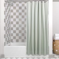 a bathroom with a checkered floor and shower curtain