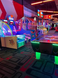 several arcade machines in a brightly lit room