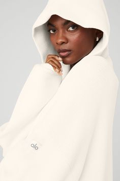 Softest. Hoodie. Ever! Made from ultra-cozy knitted cotton yarn, the Scholar Hooded Sweater is a 10/10. It’s warming yet breathable with classic features like a kangaroo front pocket for stashing small essentials and a ribbed hem and cuffs for a snug fit. A built-in hood and dropped shoulders complete the cozy, off-duty vibe. Pair it with any super-soft sweats in your closet and wear on repeat. Ultra-cozy knitted cotton yarn Built-in hood & kangaroo front pocket Unisex style Designed & uniquely Alo Yoga Sweater For Fall Loungewear, White Stretch Hoodie For Winter, White Casual Hoodie For Cold Weather, Cozy Fit Hoodie With Ribbed Cuffs For Cold Weather, Cream Sporty Sweater For Fall, Alo Yoga Fall Sweater For Loungewear, Alo Yoga Casual Sweater For Loungewear, Alo Yoga Long Sleeve Top For Winter, White Hoodie For Cold Weather In Fall