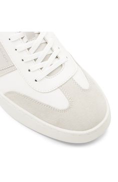 Signature logos and contrasting accents add street-savvy elements to a versatile sneaker grounded by a cushioned footbed and classic cupsole. Synthetic upper/textile lining/rubber sole Imported Suede Sneakers With White Sole And Embossed Logo, High-top Synthetic Sneakers With Embossed Logo And Round Toe, Synthetic High-top Sneakers With Embossed Logo And Round Toe, High-top Sneakers With Embossed Logo And Round Toe, White Suede Mid-top Sneakers, White Mid-top Suede Sneakers, Casual Lace-up High-top Sneakers With Embossed Logo, Sporty Canvas High-top Sneakers With Cushioned Footbed, White Suede Skate Shoes With Cushioned Footbed