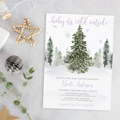 baby it's cold outside christmas card with pine trees and snowflakes on the background