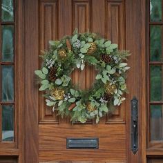 a wooden door with a wreath on it