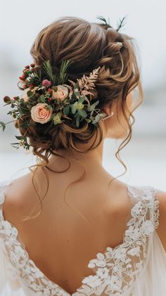 a woman with flowers in her hair is wearing a wedding dress and looking off into the distance