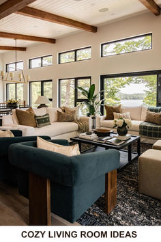 a living room filled with furniture and lots of windows