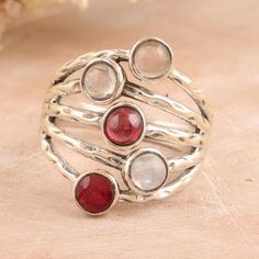 A cosmic dance made by round gemstones in warm hues reminds us of the mysteries of love and passion. Local artisans collaborate with India's Shivani Choudhary to create a stunning cocktail ring in a combination finish, featuring a magical gathering of precious jewels, including garnet, rose quartz, rainbow moonstone, ruby and labradorite. Fusion Style Natural Stone Rings For Anniversary, Fusion Style Natural Stones Ring For Anniversary, Fusion Rings With Natural Stones For Anniversary, Fusion Style Anniversary Rings With Natural Stones, Artisan Rings With Stones, Fusion Style Multi-stone Round Rings, Unique Gemstone Birthstone Ring, Spiritual Style Stackable Rings With Natural Stones, Fusion Style Stackable Round Rings As A Gift