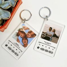 two personalized key chains with pictures on them