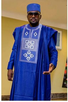 This is an African men agbada. It's available in all sizes and different colors. It's suitable for occasions like wedding, anniversary, birthday, engagements, Thanksgiving and lots more. This outfit is fully customizable, You can reach out to me through afrikrea conversation or WhatsApp (+2348036880228) for customization. Thanks for visiting! Blue Agbada With Traditional Patterns For Ceremonies, Blue Traditional Formal Agbada, Traditional Groom's Agbada For Festive Occasions, Traditional Agbada For Groom In Festive Season, Traditional Festive Agbada For Groom, Traditional Long Sleeve Agbada For Ceremonial Events, Traditional Long Sleeve Ceremonial Agbada, Ceremonial Long Sleeve Agbada For Eid