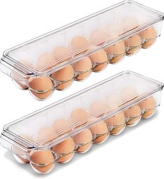 two trays filled with brown eggs on top of each other and one is empty