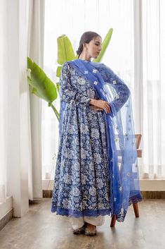 Cotton Blue Printed Anarkali Suit Set with Organza Dupatta The set consists of printed anarkali kurta with lace detailing on the edges teamed with solid white pajama and an organza dupatta with embroidery detailing Kurta Length-50 inches Palazzo Length-38 inches Dupatta Length-2.5 meters Work-Print Detailing Color-Blue and White Kurta Fabric-Cotton Bottom Fabric-Cotton Dupatta Fabric-Organza Model Size- 5.8 tall wearing small size Sleeves - 3/4th Sleeves Neck-Round neck Washing Care-Hand wash or Blue Embroidered Organza Anarkali Set, Blue Anarkali Organza Dupatta, Blue Organza Unstitched Suit With Dupatta, Blue Cotton Anarkali Set With Cutdana, Blue Cotton Anarkali Set With Sheer Dupatta, Gulabo Jaipur, Printed Anarkali Suits, Floral Print Anarkali, Blue Anarkali