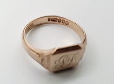 Vintage 9ct Gold Signet Ring.The gold has a lovely slight rose tint to it.Hallmarked London 1953, Makers Mark WWLtdCurrently has a monogram of SF engraved on the front. This can be left as it is or polished off and left plain. Please see example before and after image.  Size W (EU 63, US 11). Free Resizing Available - please message or email info@sobellejewellery.comWeight: 5.5gFront: 12mm x 10mmShoulders: 5mmBack: 3mmCondition:  Good, clean vintage condition. All items will have a full professi Heirloom Rose Gold Rings With Hallmarks, Hallmarked Rose Gold Signet Ring For Wedding, Hallmarked Engraved Rose Gold Ring, Rose Gold Hallmarked Signet Ring For Wedding, Formal Hallmarked Rose Gold Engraved Ring, Rose Gold Engraved Ring, Hallmarked, Formal Rose Gold Engraved Ring Hallmarked, Rose Gold Engraved Ring With Hallmark, Formal Rose Gold Engraved Ring With Hallmark