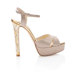 Made from sumptuous shimmering suede, and feature a jewelled heel with a floral motif that has hand-cut and brass, inlaid with iridescent ivory mother of pearl.  Our 'Rose in Bloom Gold' platform shoes are set on a towering stiletto heel that's balanced by a sturdy 4cm platform. Each piece of Mother of Pearl is individually and carefully hand-cut, before being applied to the heel with resin. As a material it is exceptionally durable, and used on the heel of the shoe means they will remain clean Pearl Clutch Bag, Gold Platform Heels, Designer Wedding Shoes, Jeweled Heels, Gold Platforms, Jeweled Shoes, Rose Shoes, Couture Shoes, Unique Shoes